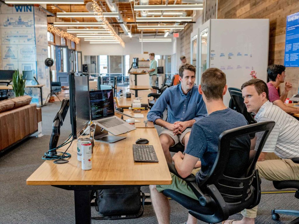 2 young professionals working on their desks